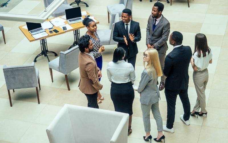 Diverse group of business people talking and working together