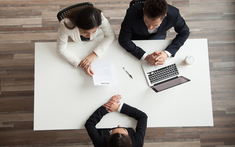 HR manager interviewing female candidate at desk